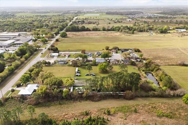 an aerial view of residential building and ocean view