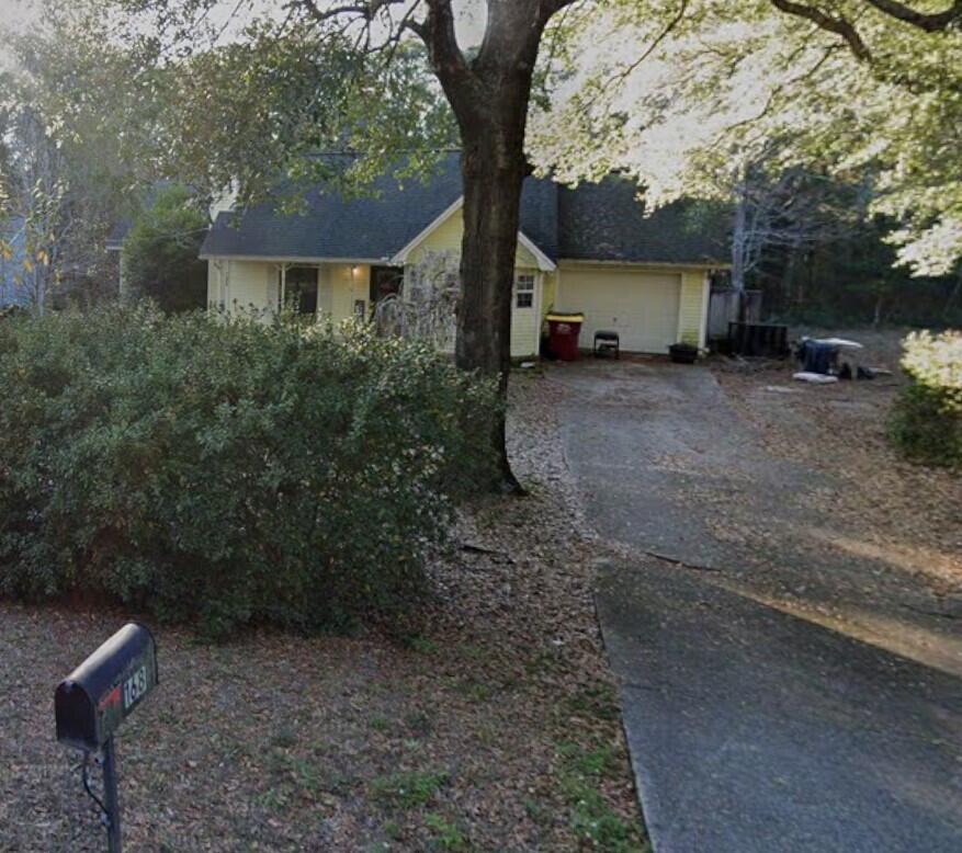 168 Ridge Lake Road Crestview, FL 32536 - Photo 11 of 11 a front view of a house with garden