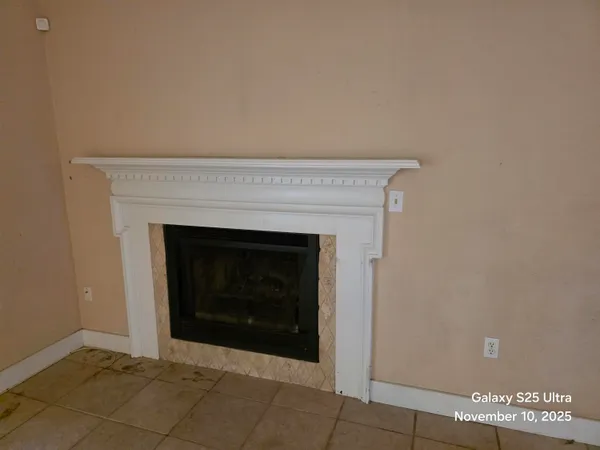 a living room with a fireplace