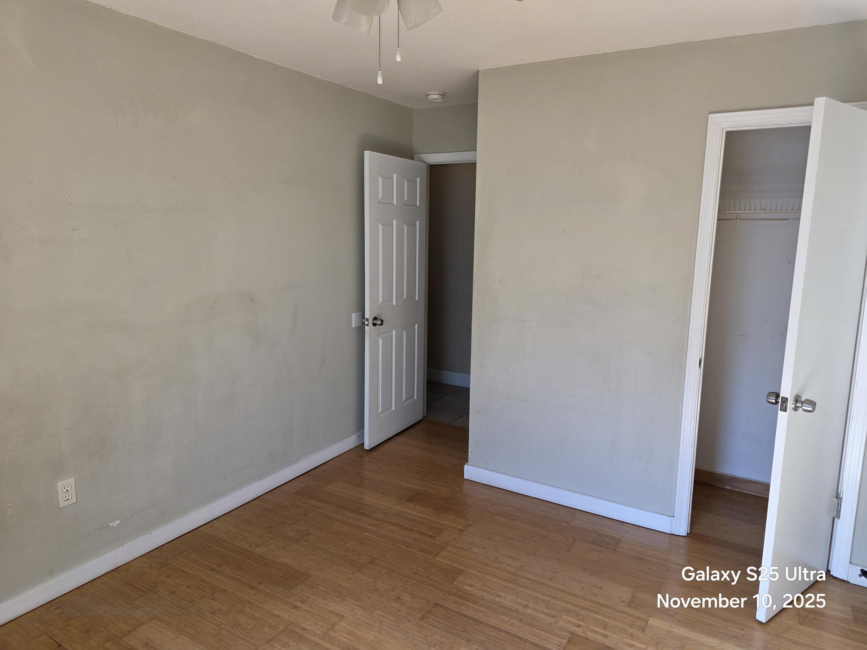 168 Ridge Lake Road Crestview, FL 32536 - Photo 6 of 11 an empty room with wooden floor and entrance