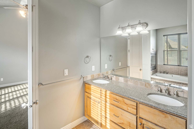 1997 West Cres Drive Mapleton, UT 84664 - Photo 16 of 35 Bathroom with double vanity and a bath