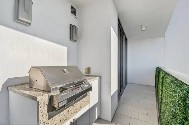 a stove top oven sitting inside of a kitchen