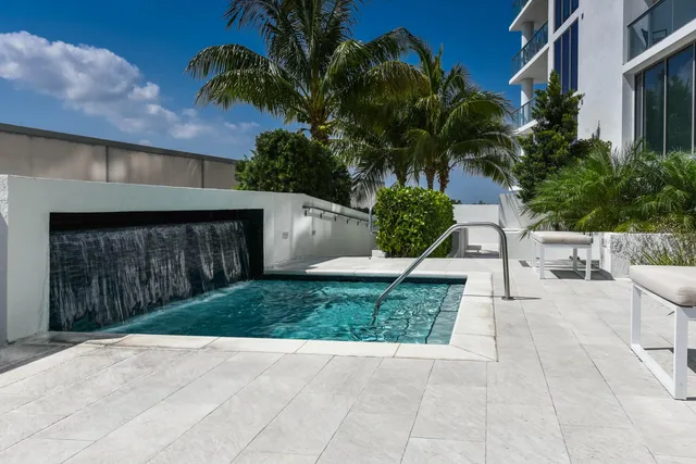 a view of house with outdoor space and a car parking garage