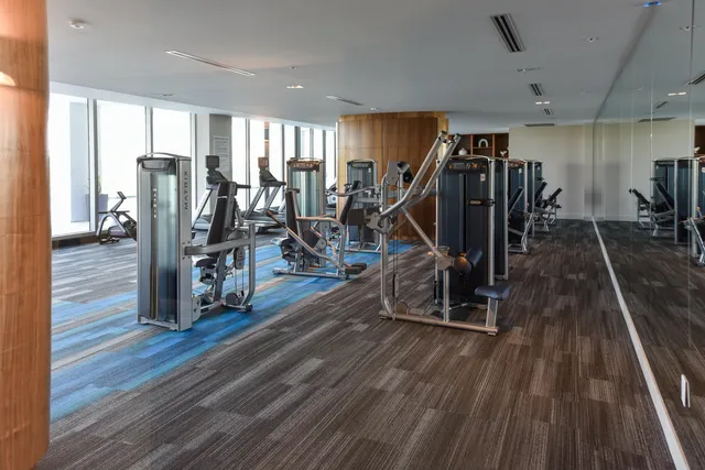 a view of a room with wooden floor stairs