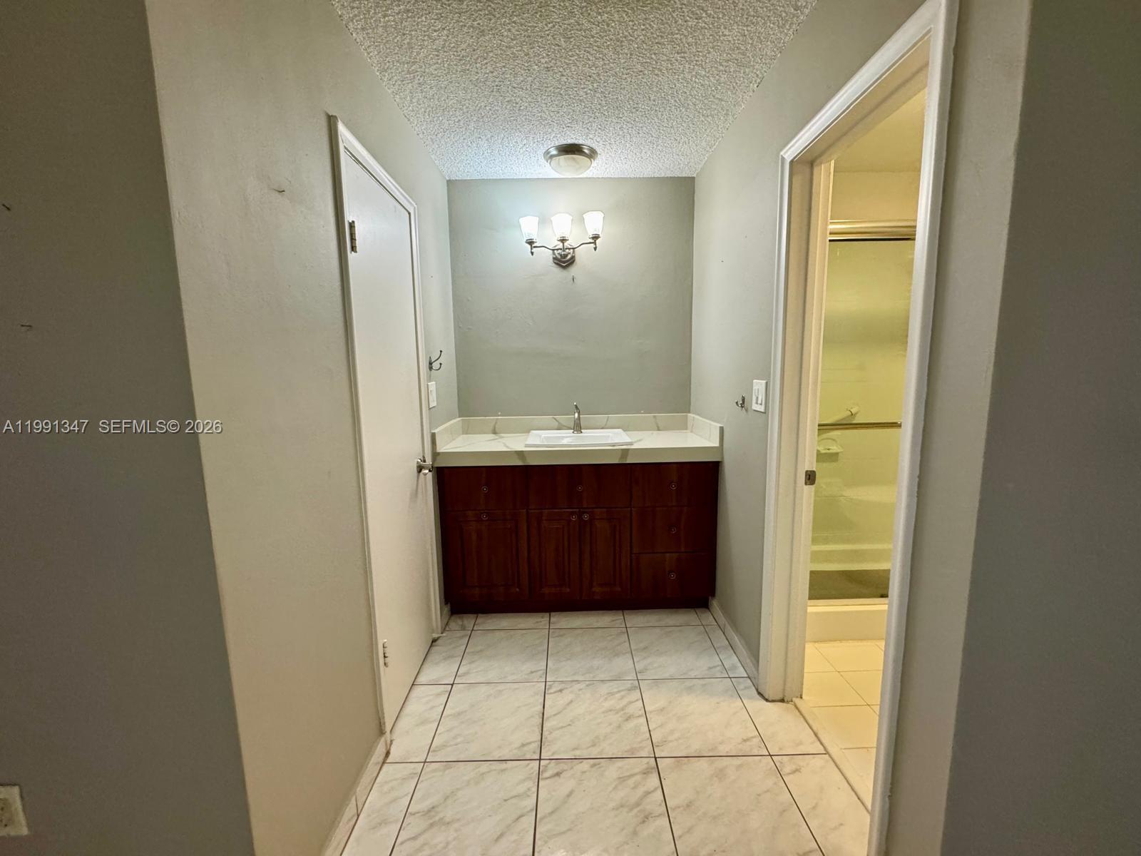 2505 Southwest 126th Avenue Miami, FL 33175 - Photo 13 of 22 a bathroom with a sink a toilet and mirror
