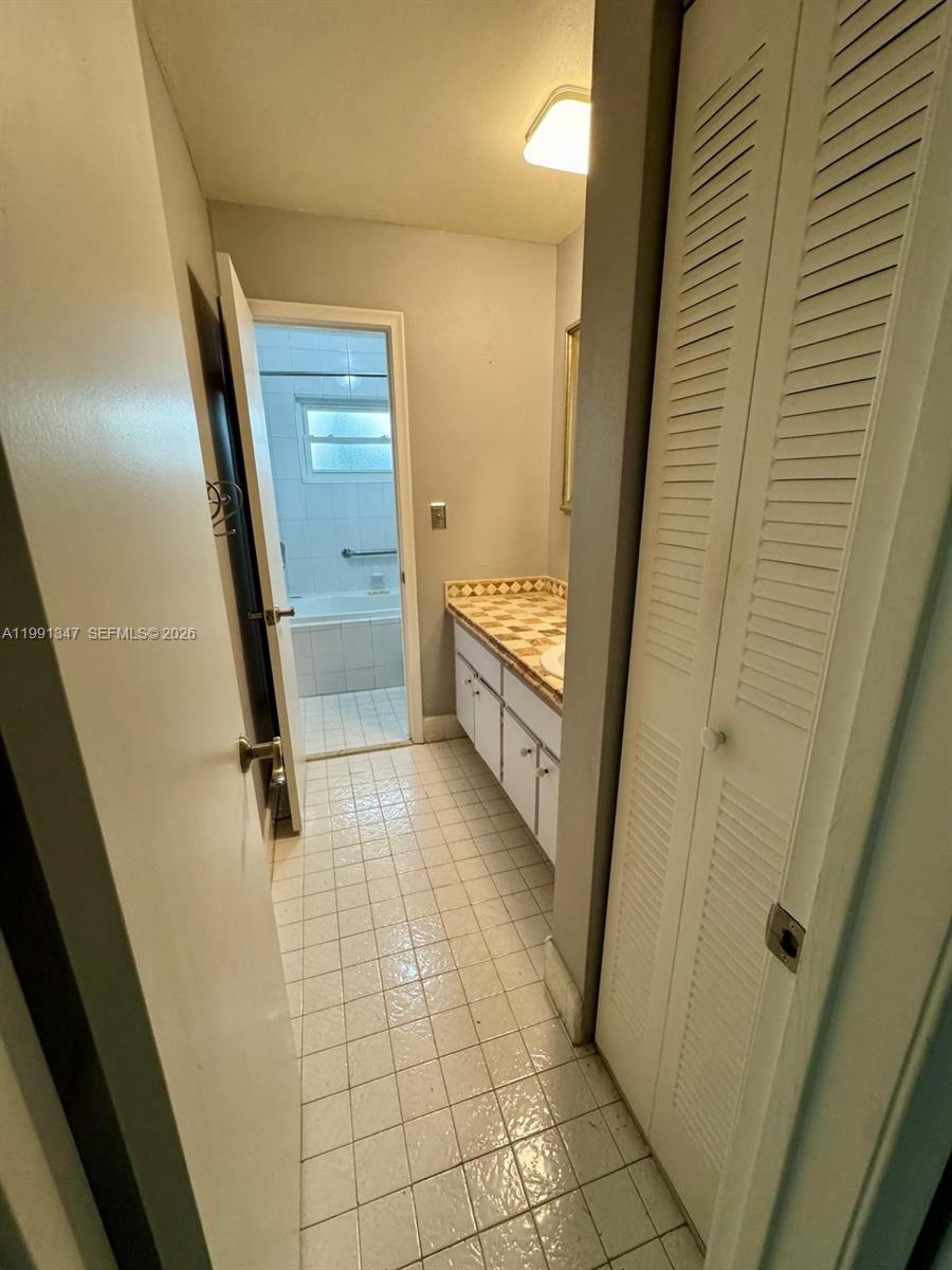 2505 Southwest 126th Avenue Miami, FL 33175 - Photo 15 of 22 a bathroom with a granite countertop shower and a sink
