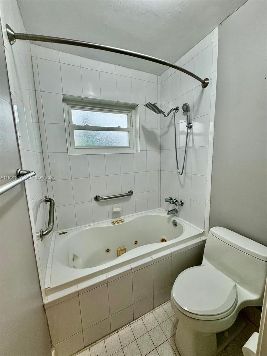2505 Southwest 126th Avenue Miami, FL 33175 - Photo 17 of 22 a white toilet sitting next to a bath tub and shower