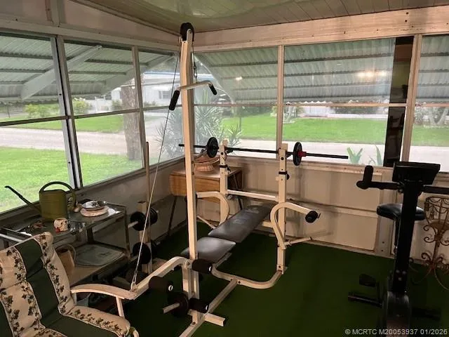 a kitchen with a table and chairs