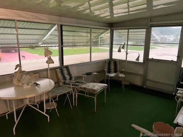 a kitchen with stainless steel appliances granite countertop a stove a microwave and a refrigerator