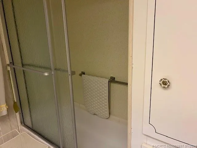 a bedroom with a bed and a cabinets