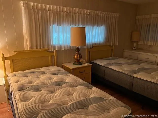 a bedroom with a bed and a television