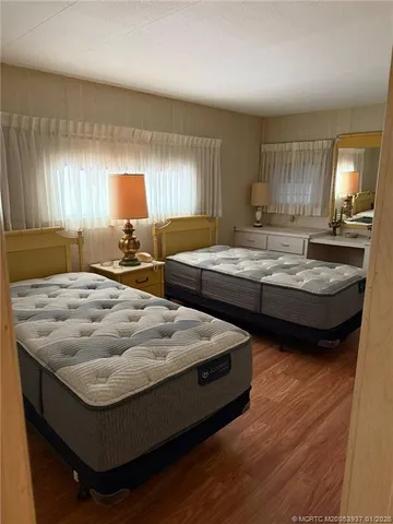 a bedroom with bed and window