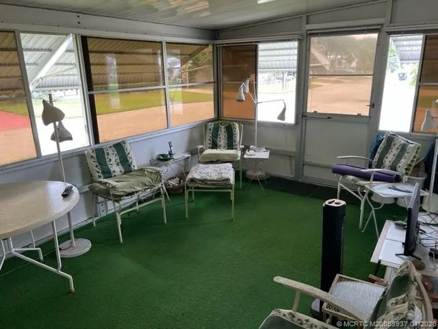 a living room with furniture and a window