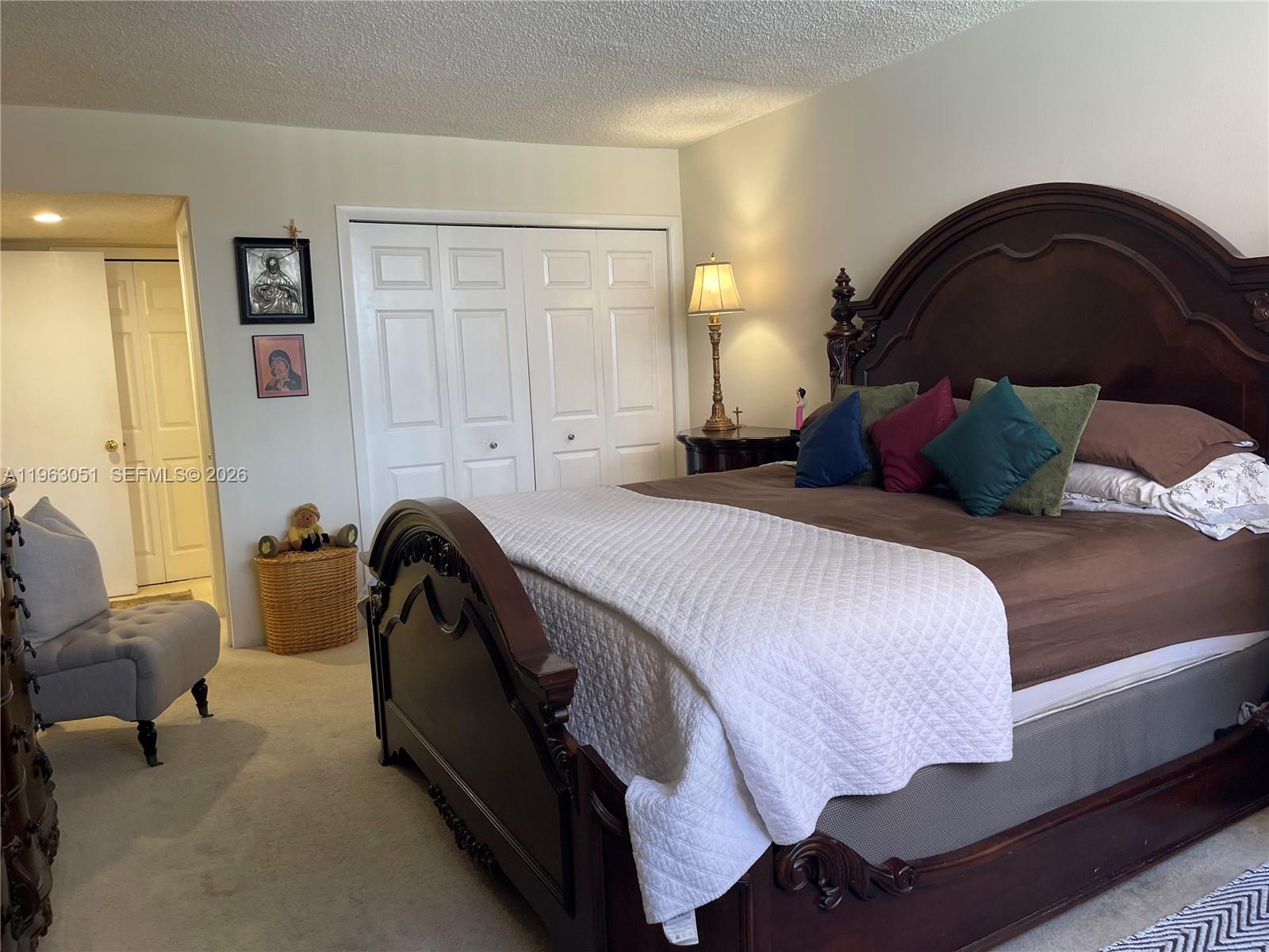 16475 Golf Club Road, Unit 309 Weston, FL 33326 - Photo 15 of 36 a bedroom with a bed and a couch