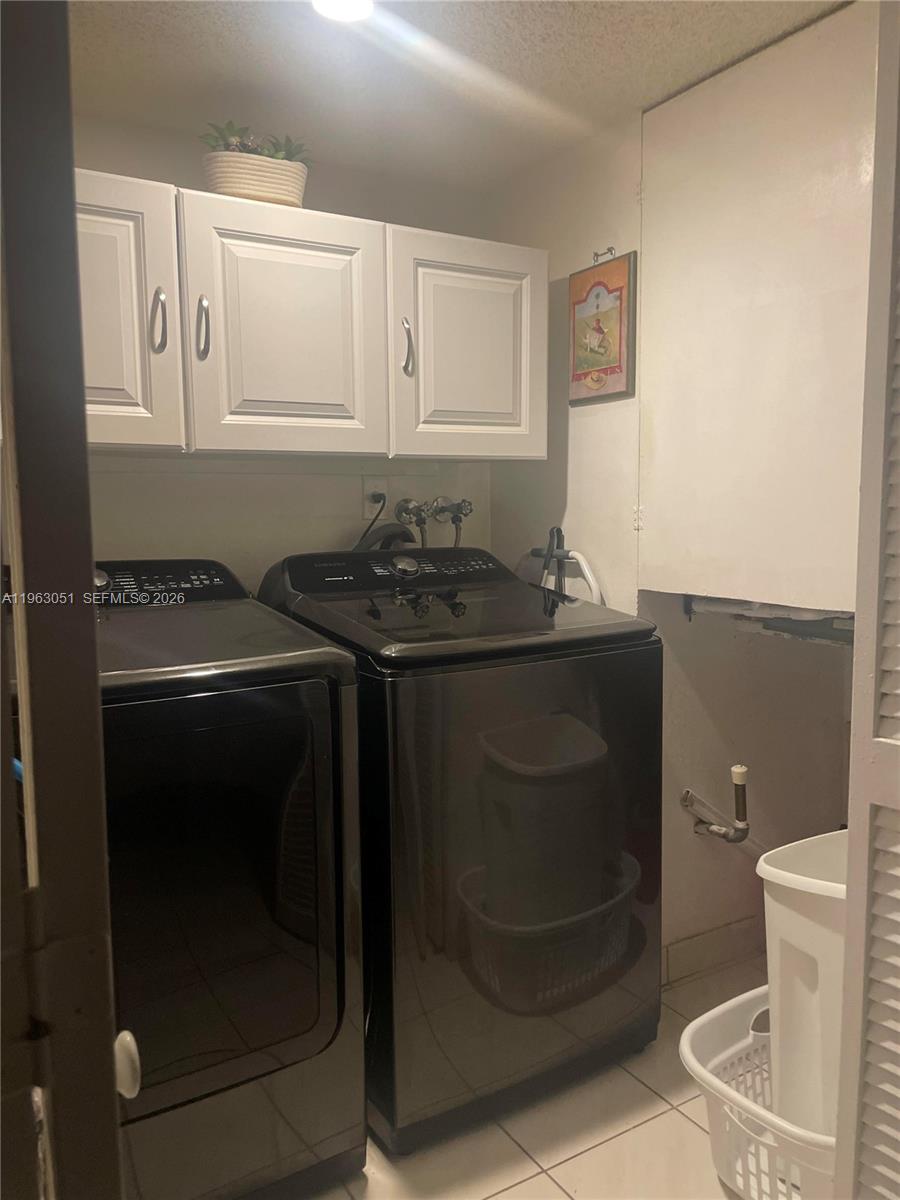 16475 Golf Club Road, Unit 309 Weston, FL 33326 - Photo 25 of 36 a bathroom with a sink a toilet and a mirror