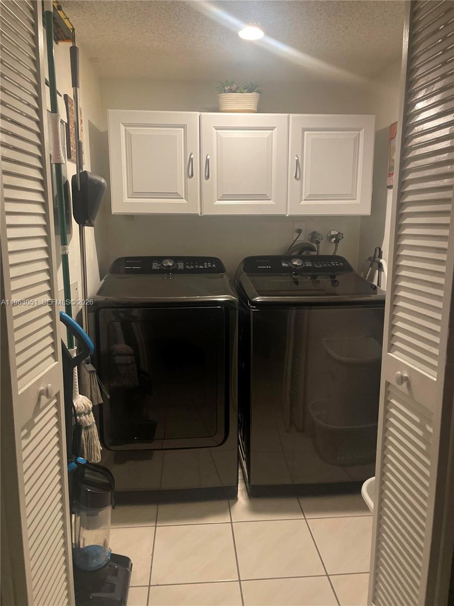 16475 Golf Club Road, Unit 309 Weston, FL 33326 - Photo 26 of 36 a stove top oven sitting inside of a kitchen