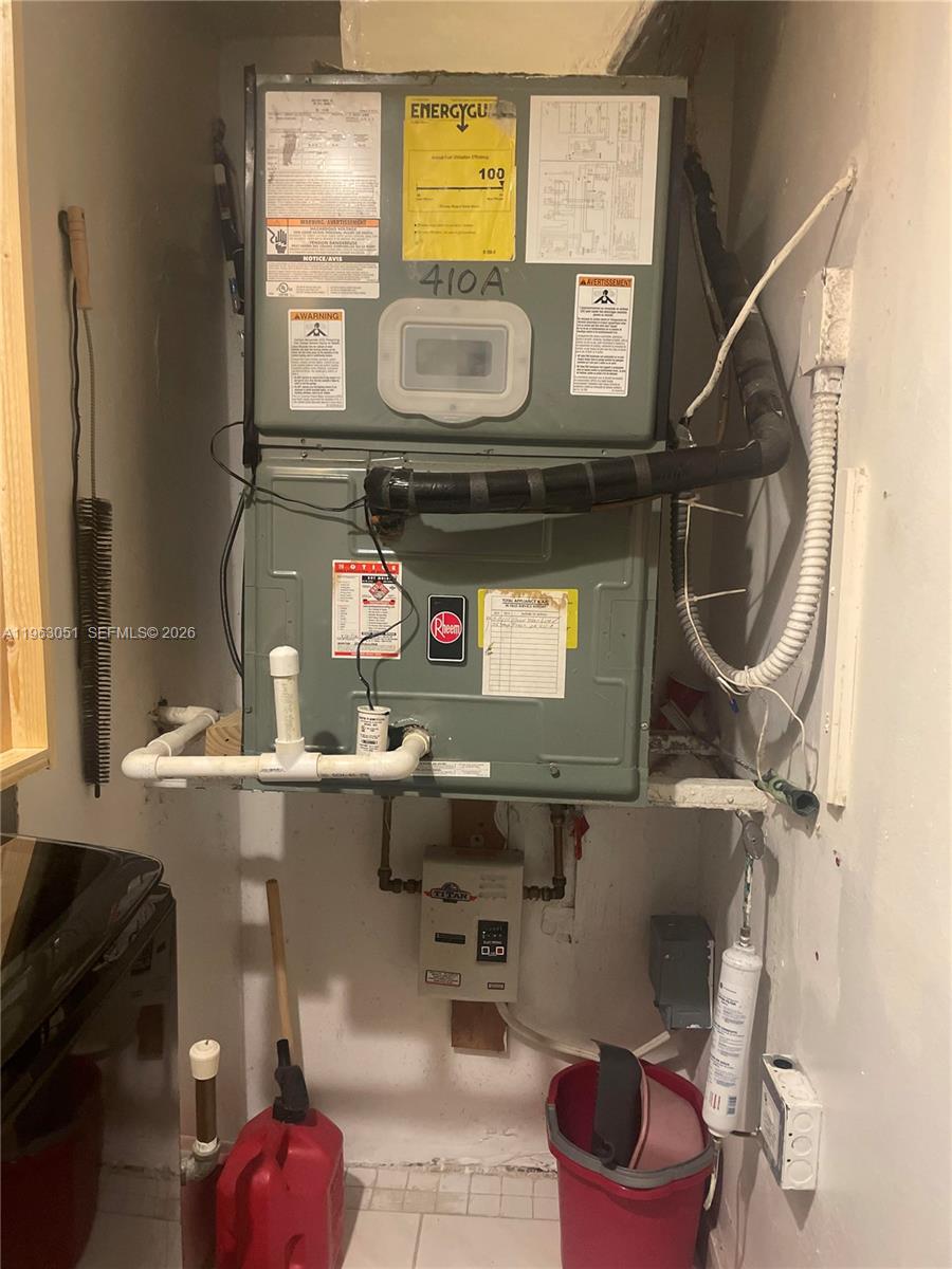 16475 Golf Club Road, Unit 309 Weston, FL 33326 - Photo 27 of 36 a utility room with dryer and washer