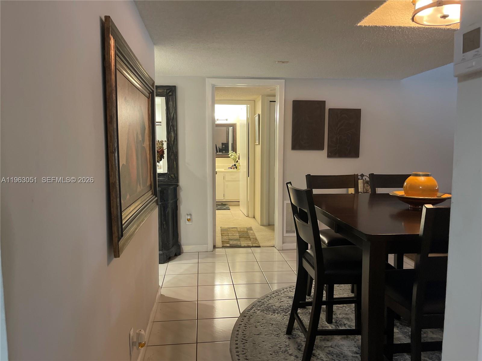 16475 Golf Club Road, Unit 309 Weston, FL 33326 - Photo 3 of 36 a view of a dining room with furniture and window