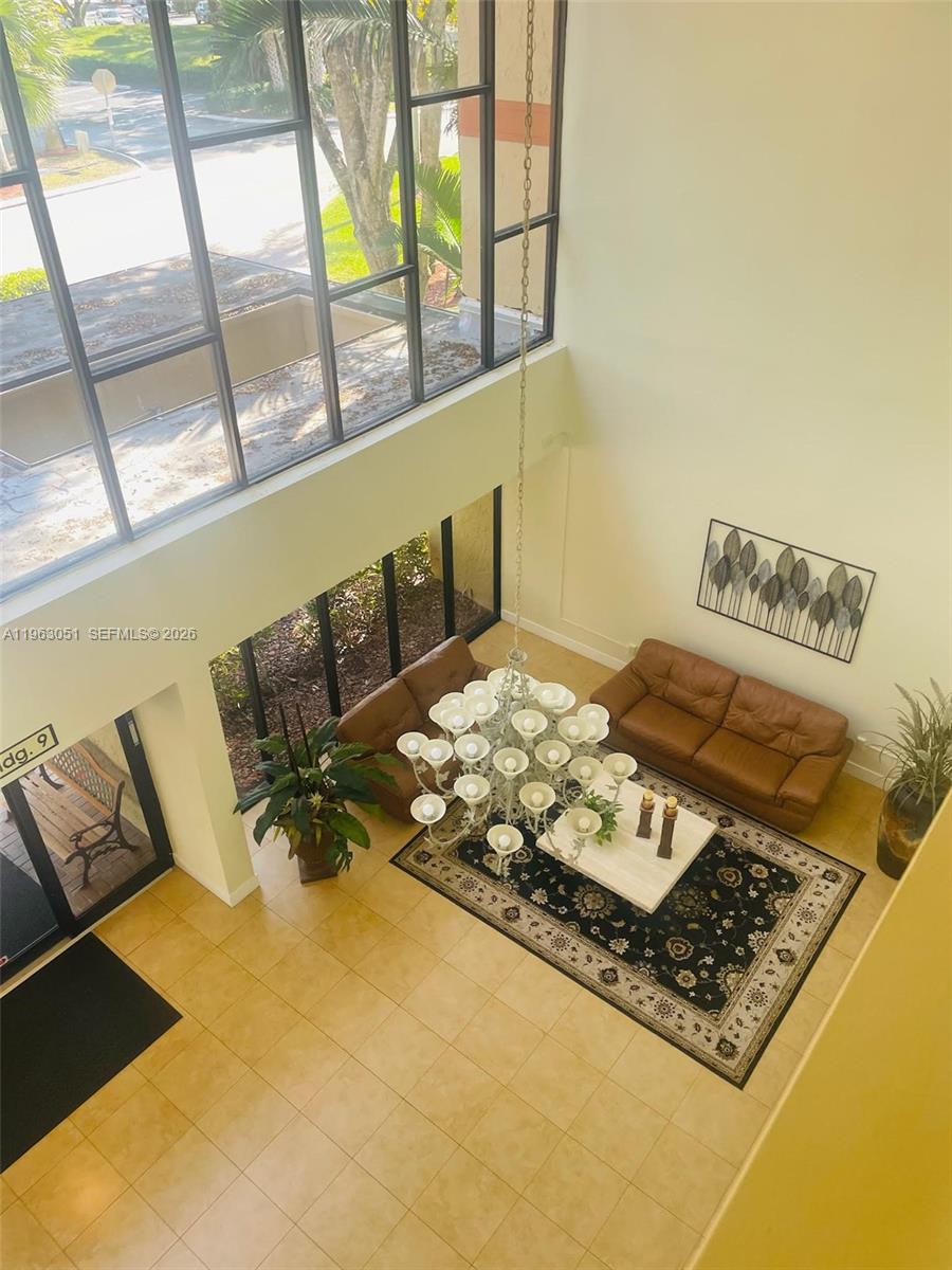 16475 Golf Club Road, Unit 309 Weston, FL 33326 - Photo 31 of 36 a living room with rug