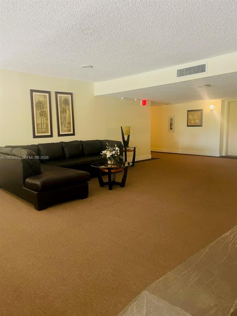 16475 Golf Club Road, Unit 309 Weston, FL 33326 - Photo 33 of 36 a living room with furniture