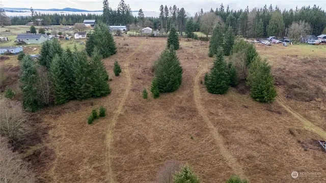 a view of a lake with beach and outdoor space