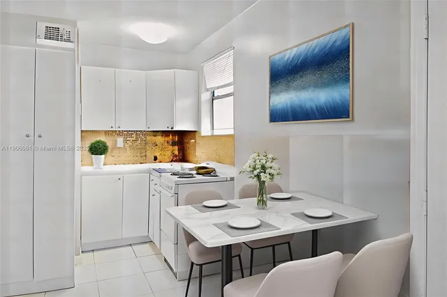 a kitchen with a sink cabinets and wooden floor