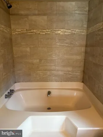 a bathroom with a bathtub
