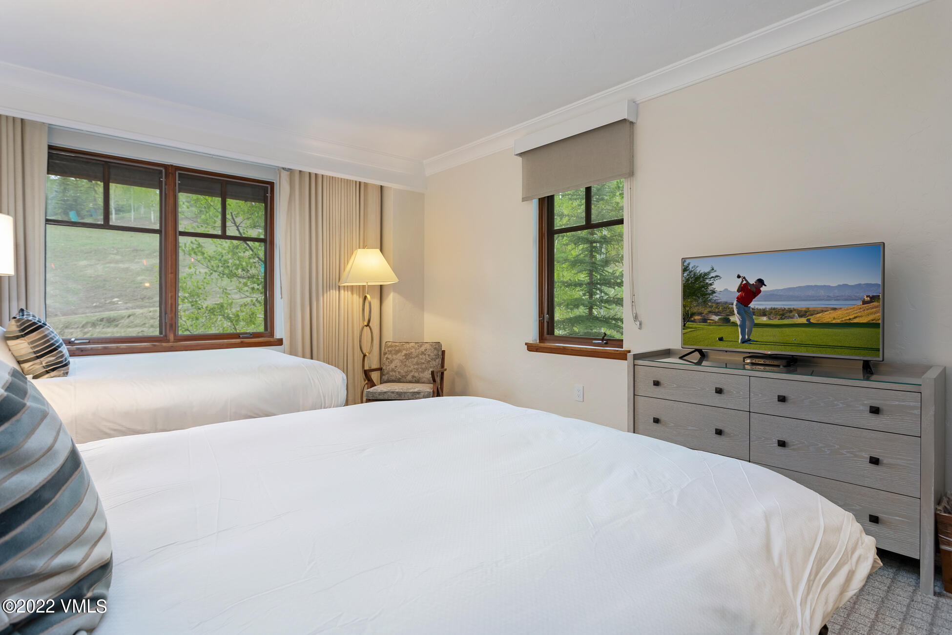 100 Bachelor Ridge Road, Unit 3402 Avon, CO 81620 - Photo 29 of 54 a bedroom with a bed and a dresser next to a window