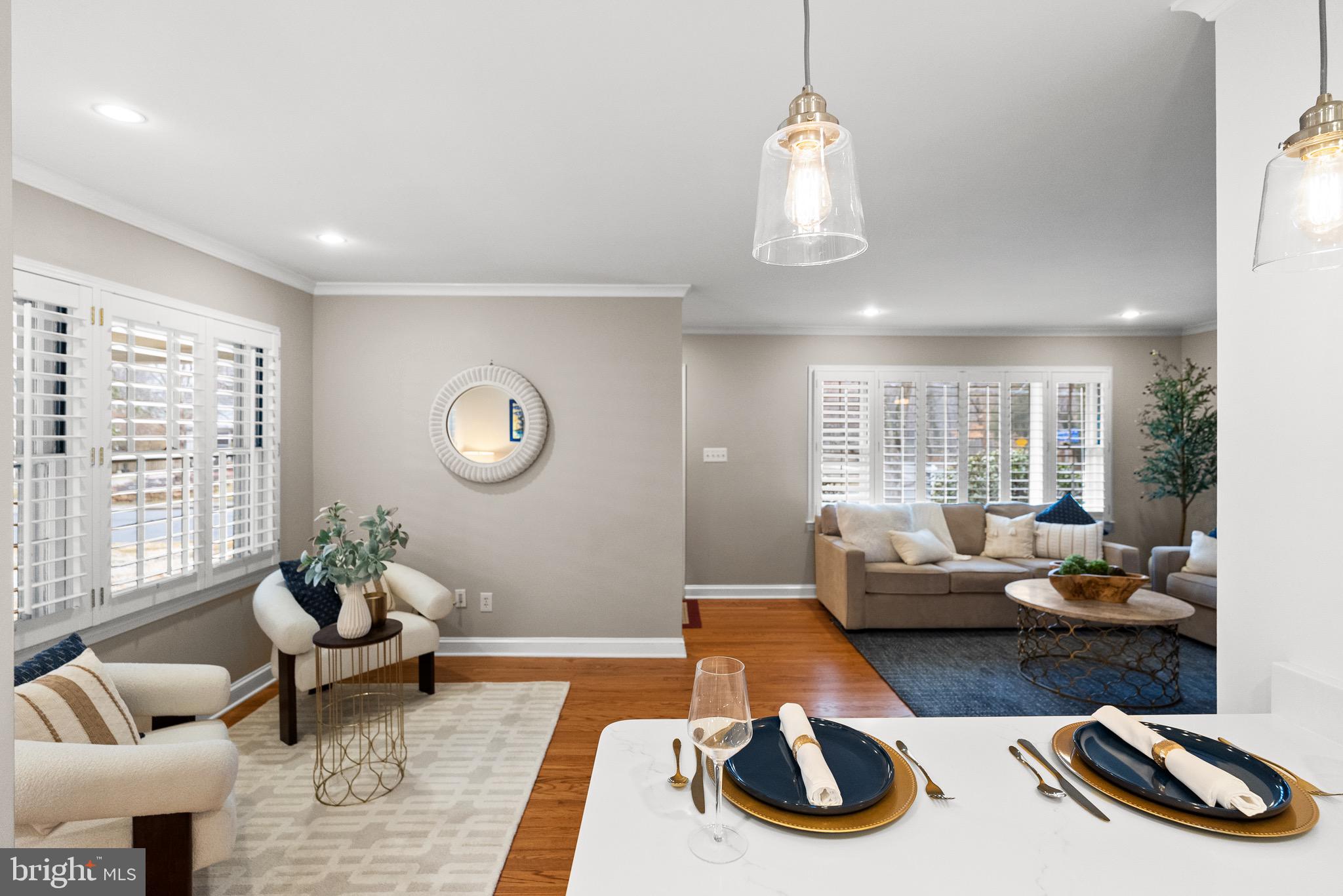 7911 Bainbridge Road Alexandria, VA 22308 - Photo 17 of 50 Peninsula breakfast bar seating opens to living