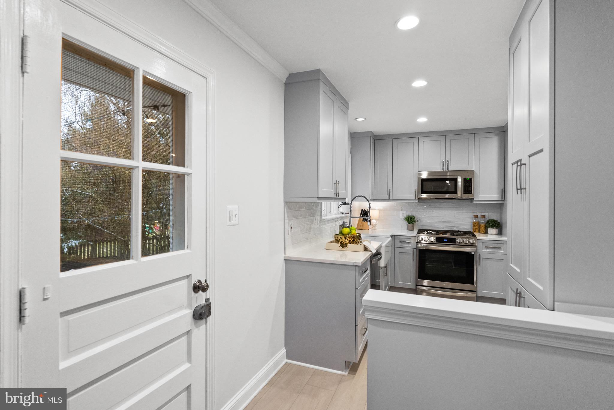 7911 Bainbridge Road Alexandria, VA 22308 - Photo 20 of 50 Access the backyard from kitchen