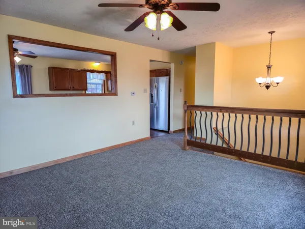 a kitchen with stainless steel appliances granite countertop cabinets and wooden floor