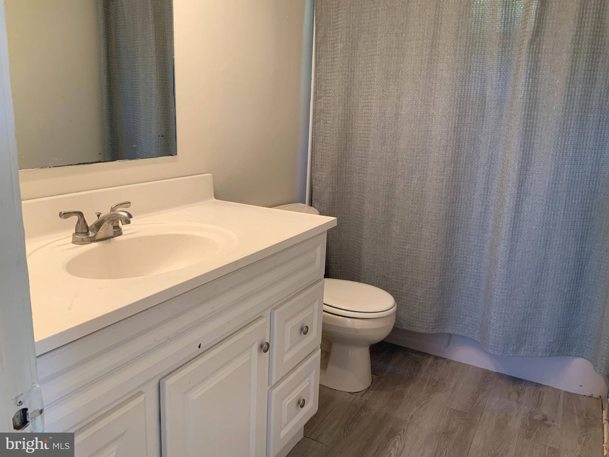 2507 Kingsway Road Fort Washington, MD 20744 - Photo 33 of 39 a bathroom with a sink a toilet and shower