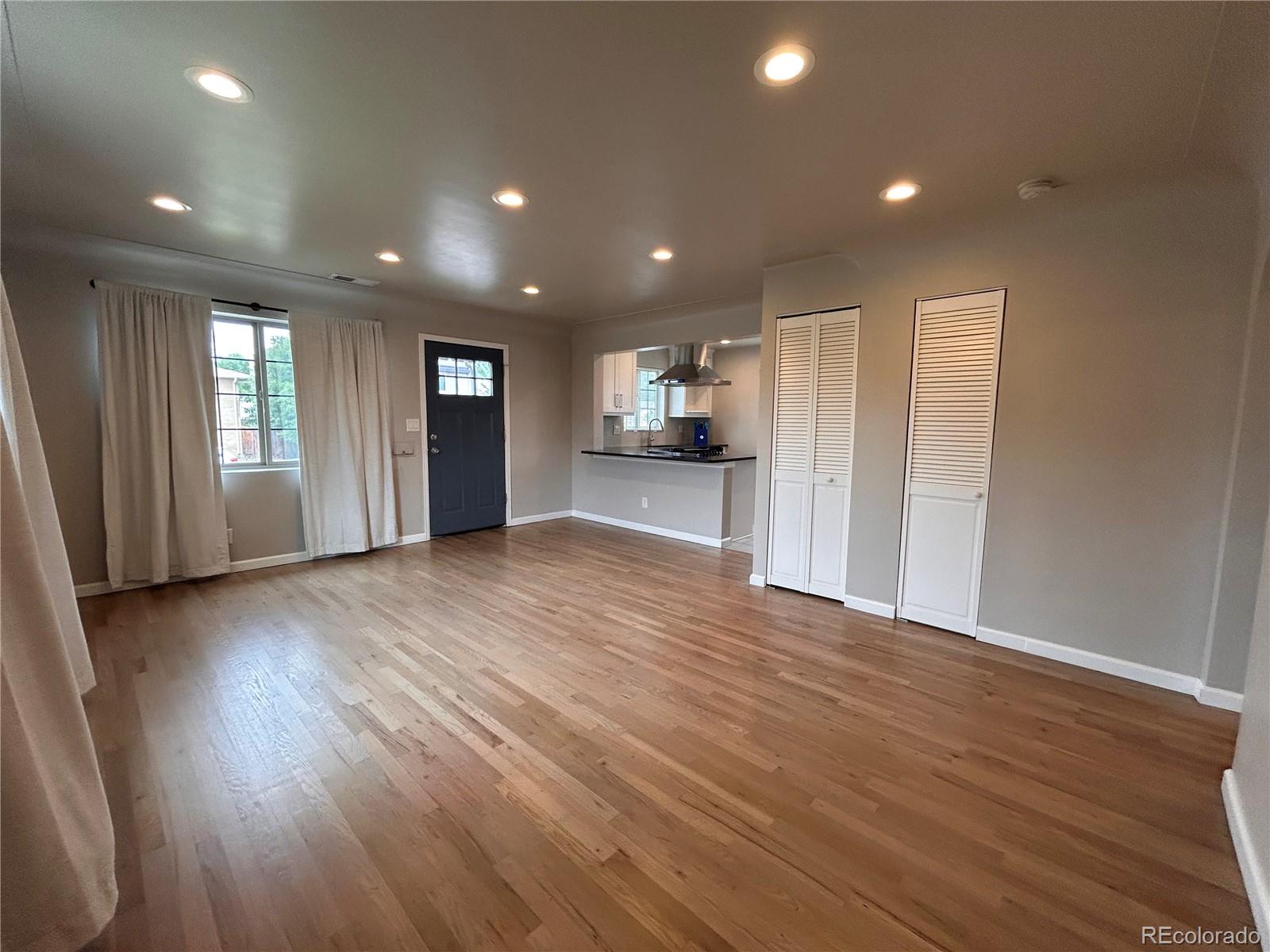 1310 Wolff Street Denver, CO 80204 - Photo 21 of 31 an empty room with wooden floor and a window