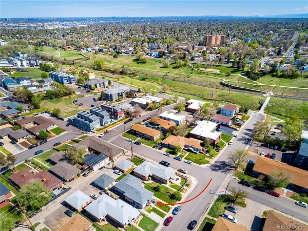 an aerial view of residential houses with outdoor space