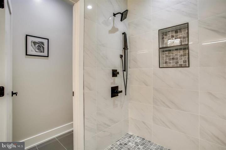 822 Madison Street Northwest Washington, DC 20011 - Photo 11 of 35 a bathroom with a shower and a glass door