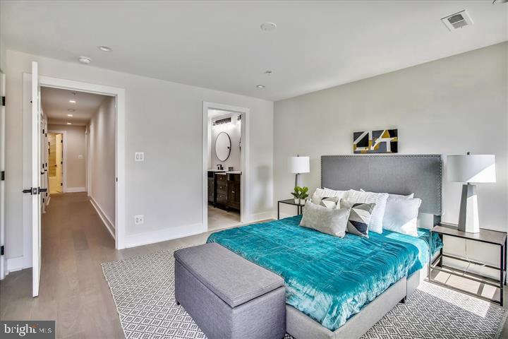 822 Madison Street Northwest Washington, DC 20011 - Photo 20 of 35 a bedroom with a bed and a couch