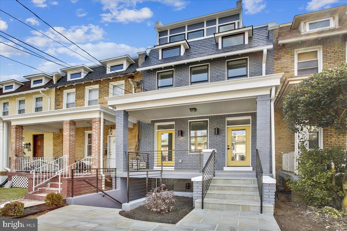 822 Madison Street Northwest Washington, DC 20011 - Photo 2 of 35 a front view of a house with outdoor seating
