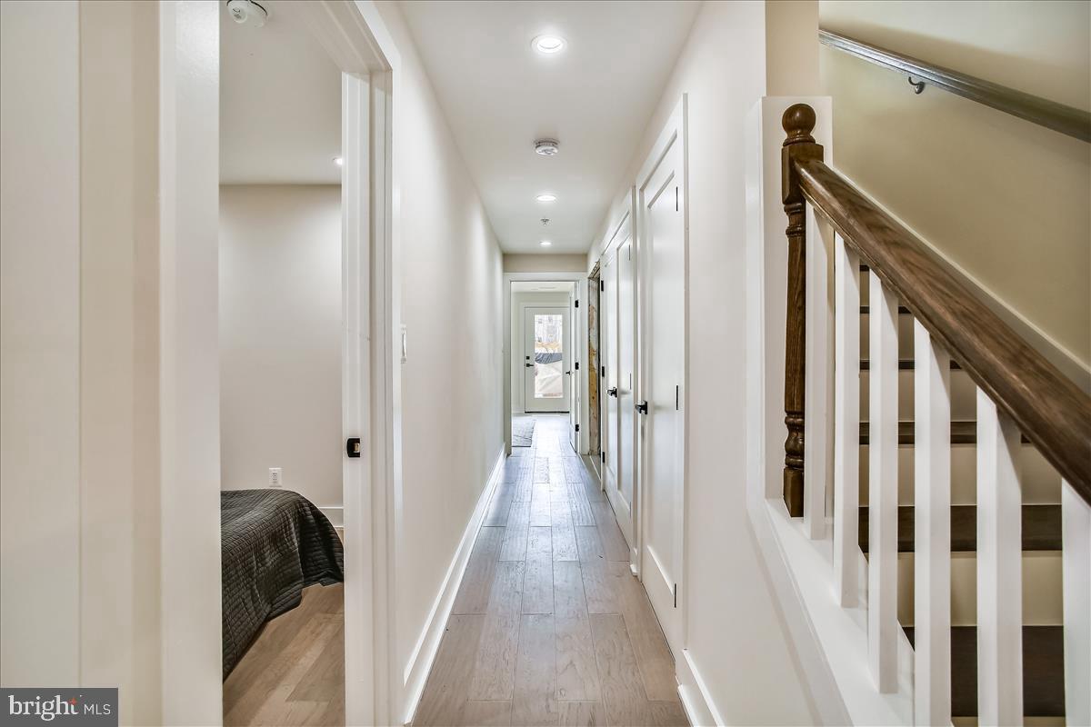 822 Madison Street Northwest Washington, DC 20011 - Photo 21 of 35 a view of a hallway with a livingroom and stairs