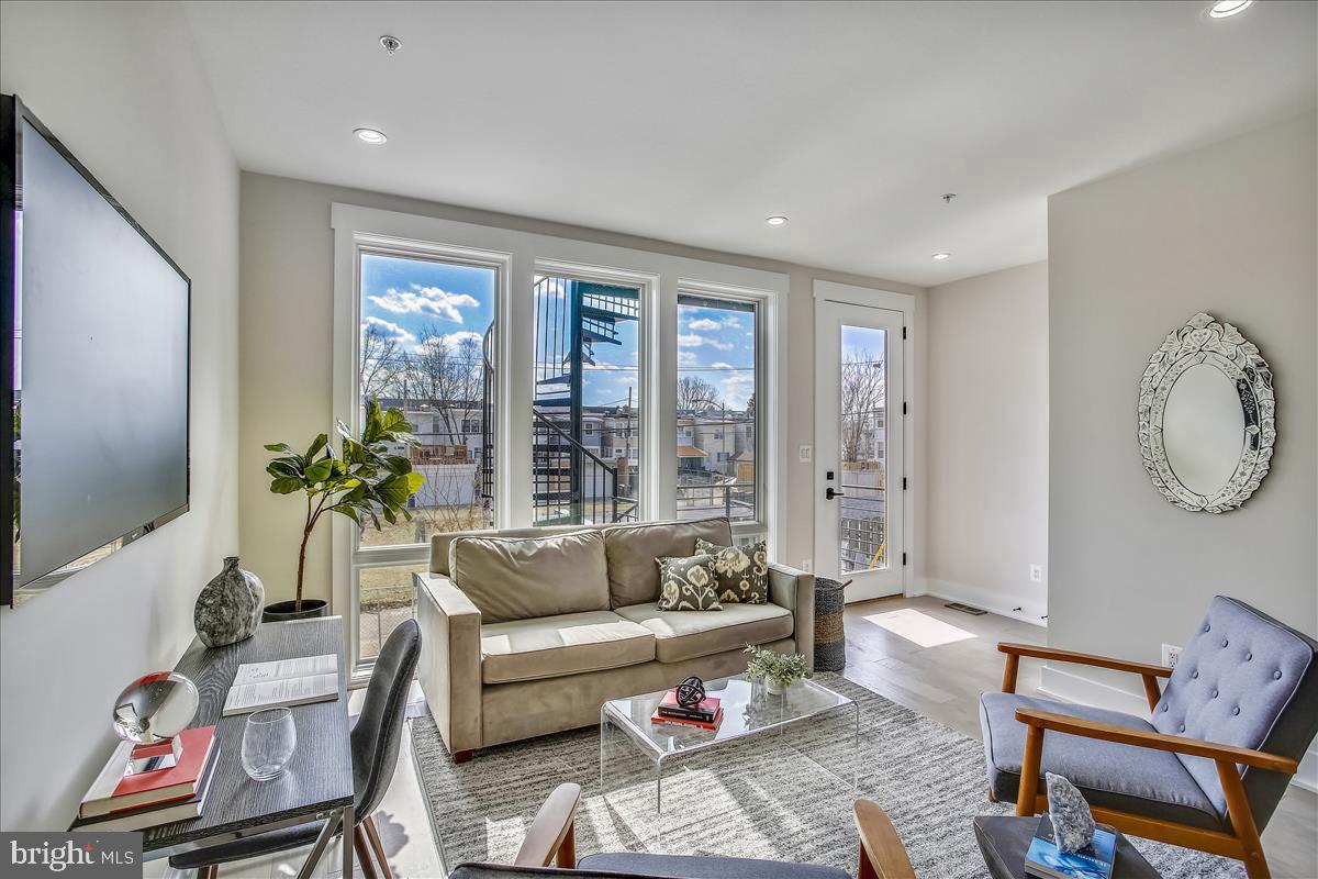 822 Madison Street Northwest Washington, DC 20011 - Photo 22 of 35 a living room with furniture and a flat screen tv
