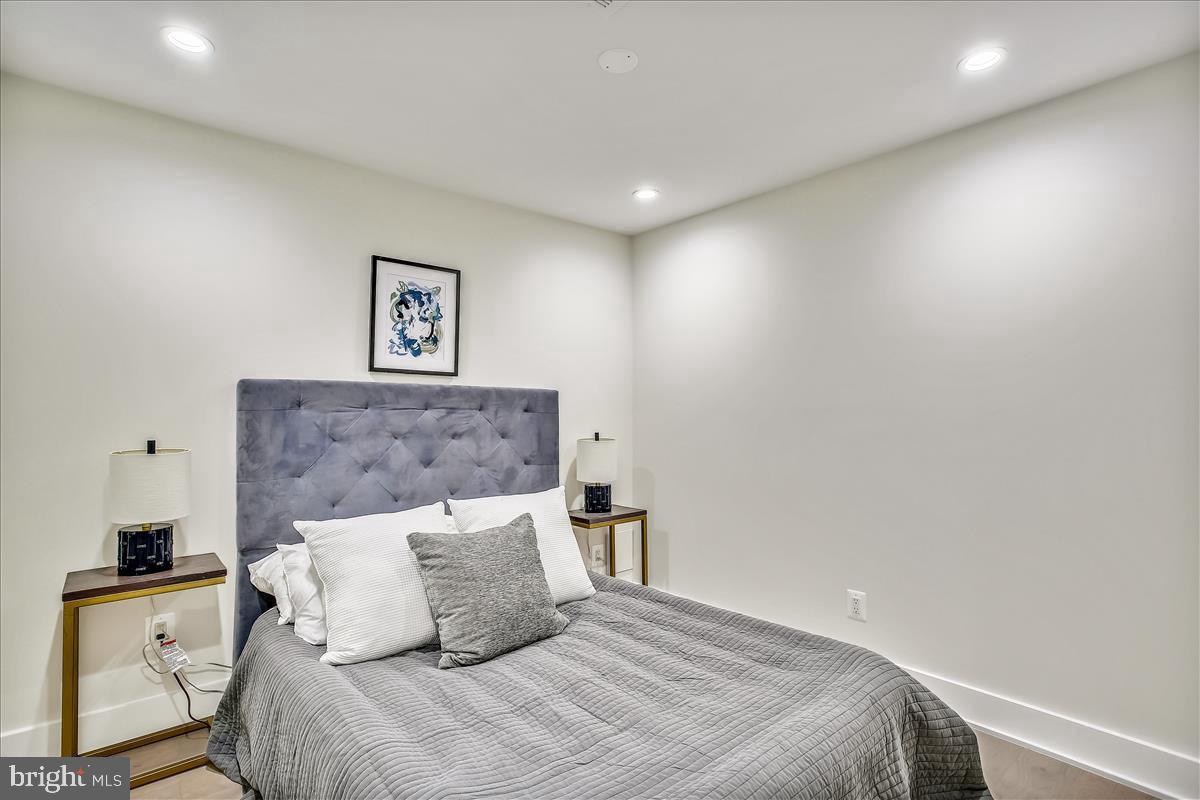 822 Madison Street Northwest Washington, DC 20011 - Photo 27 of 35 a bedroom with a bed and a couch