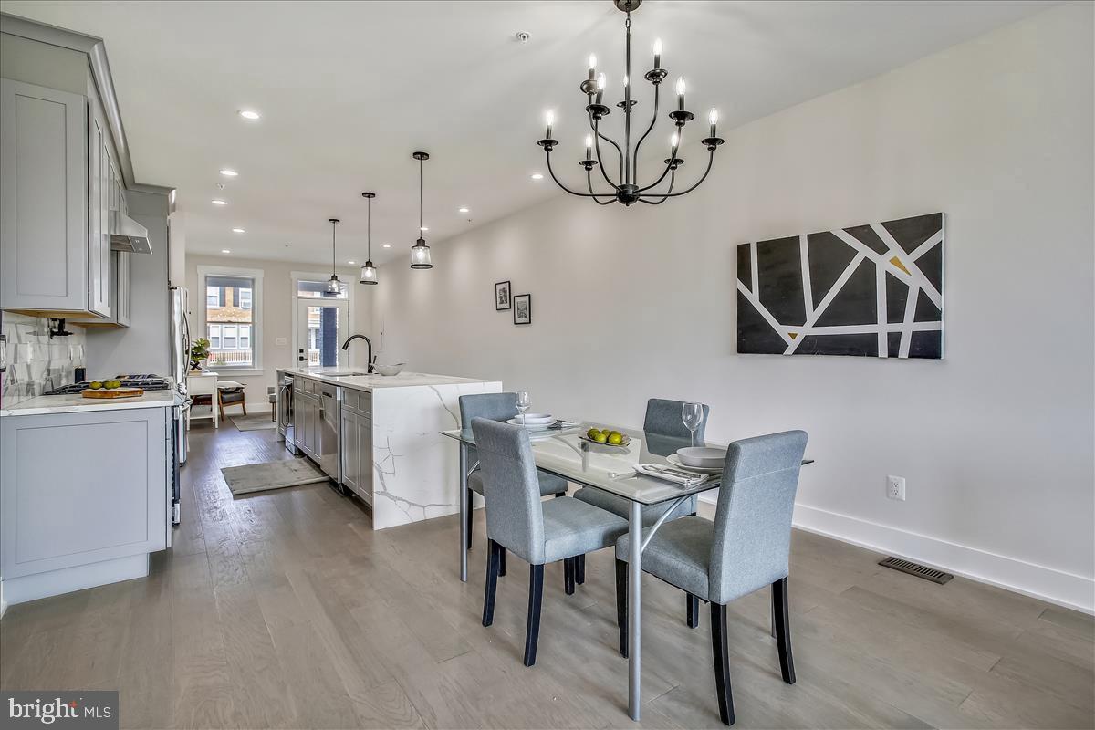 822 Madison Street Northwest Washington, DC 20011 - Photo 28 of 35 a view of a dining room with furniture and chandelier