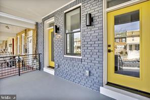 822 Madison Street Northwest Washington, DC 20011 - Photo 3 of 35 a view of front door of house with a porch