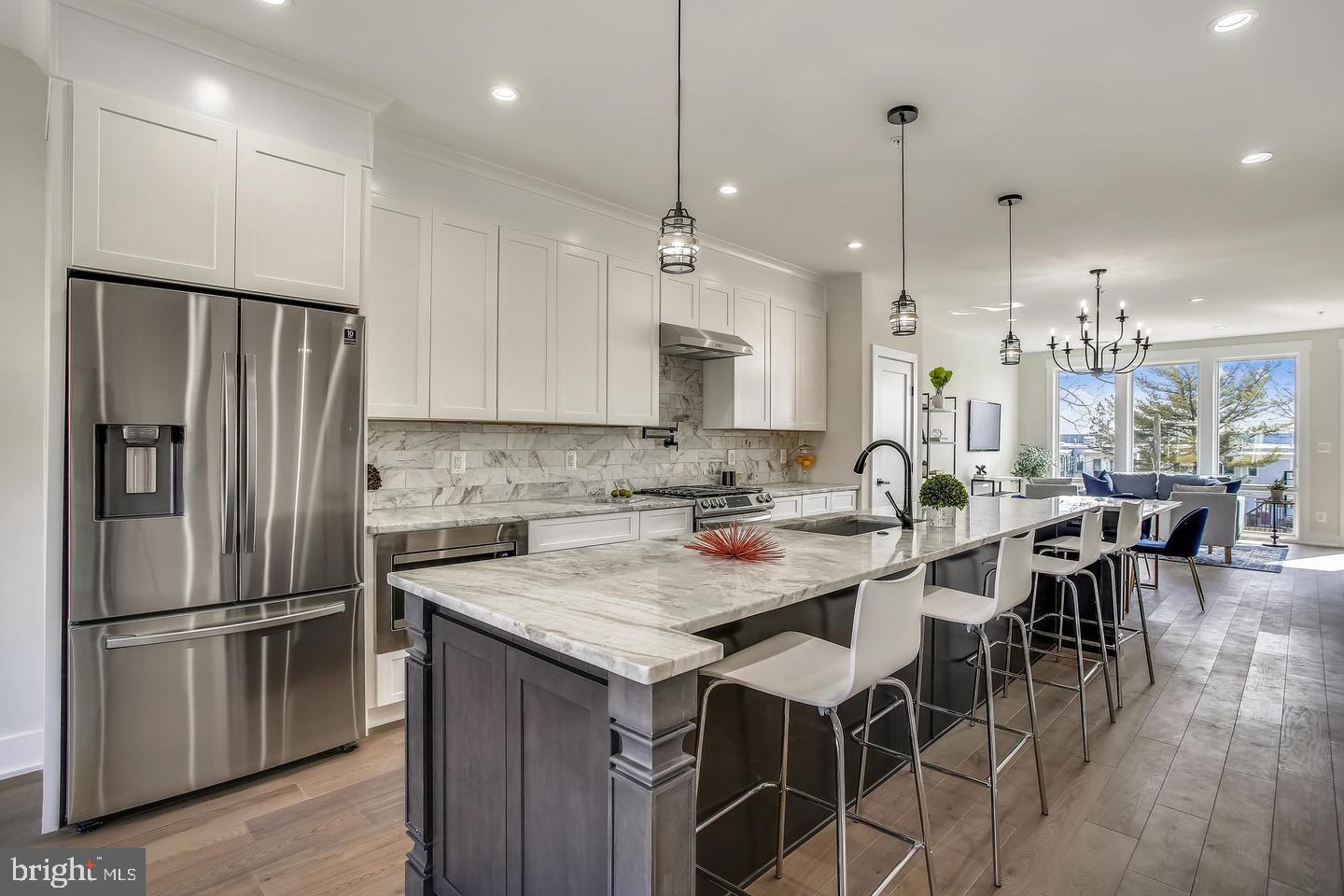822 Madison Street Northwest Washington, DC 20011 - Photo 6 of 35 a kitchen with stainless steel appliances granite countertop a refrigerator a sink a stove a dining table and chairs