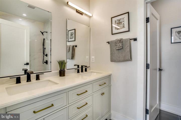 822 Madison Street Northwest Washington, DC 20011 - Photo 8 of 35 a bathroom with a sink and a mirror