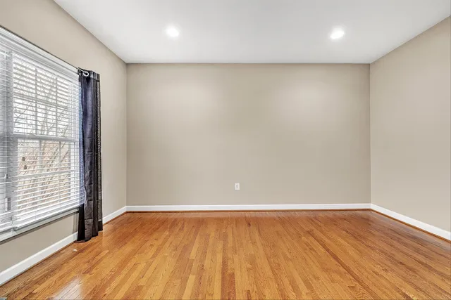 a bedroom with a bed furniture and a window