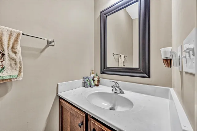 a bathroom with a sink a mirror and a shower