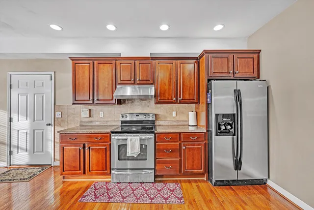 a white toilet sitting next to a bathroom sink
