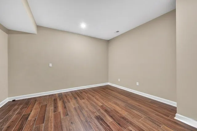 a view of a house with a swimming pool and sitting area