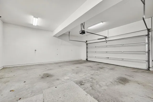 an aerial view of residential houses with outdoor space and swimming pool