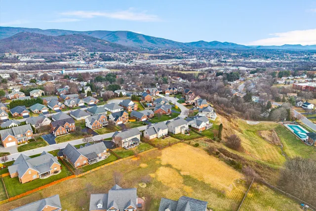 a kitchen with stainless steel appliances granite countertop sink stove refrigerator and cabinets
